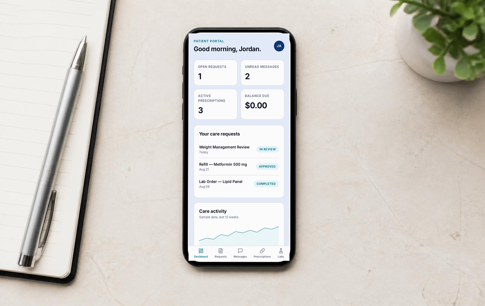 A phone on a desk showing a demo screenshot of the Plunge Care portal on mobile